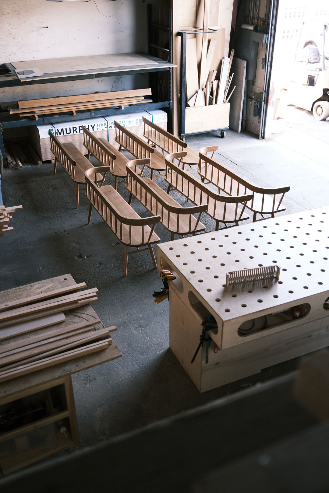 Japanese Benches Wood furniture lined up in a woodworking shop, the product is finished with Osmo Polyx Oil in 3043 Satin.