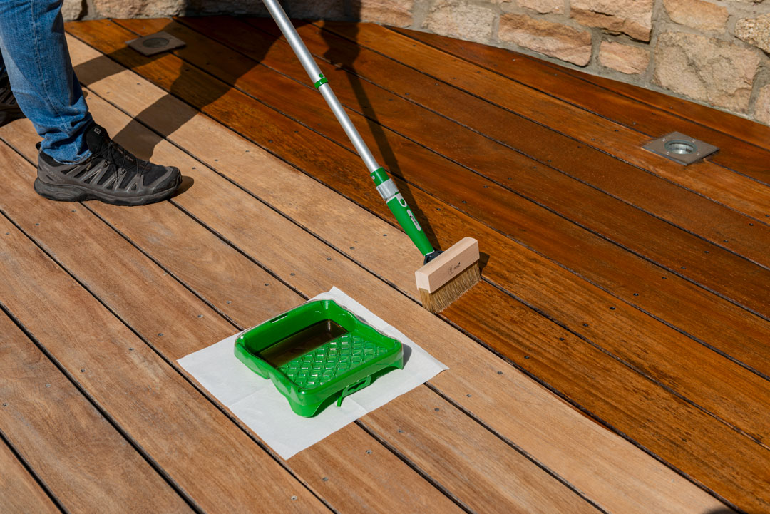 Decking-Oil-(5)-web Summer deck maintenance, applying Deck Stain to an outdoor patio.