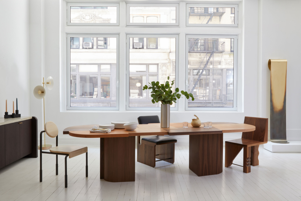 Shown here in solid walnut, sapele and cherry with a double pedestal base.