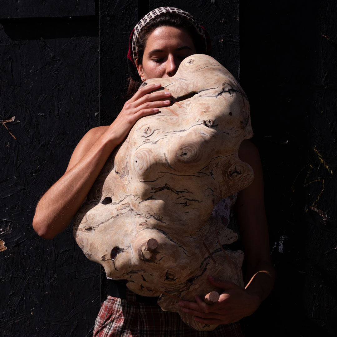 project-2-A-web Ash Pales holding her scuplture finished with Osmo Wood Wax Finish