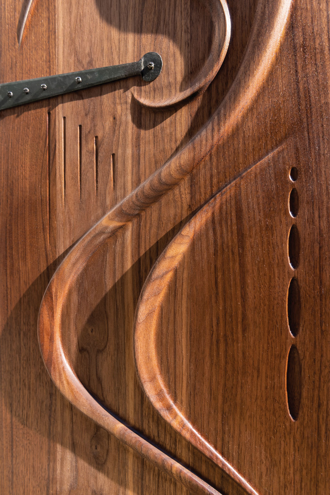 Horror Vacui – Ash Pales A sculptural and ornate wood door made by Ash Pales and finished with Osmo wood finish.