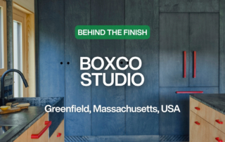 Custom blue kitchen cabinets with the text "Behind the Finish: Boxco Studio. Greenfield, Massachusetts, USA"